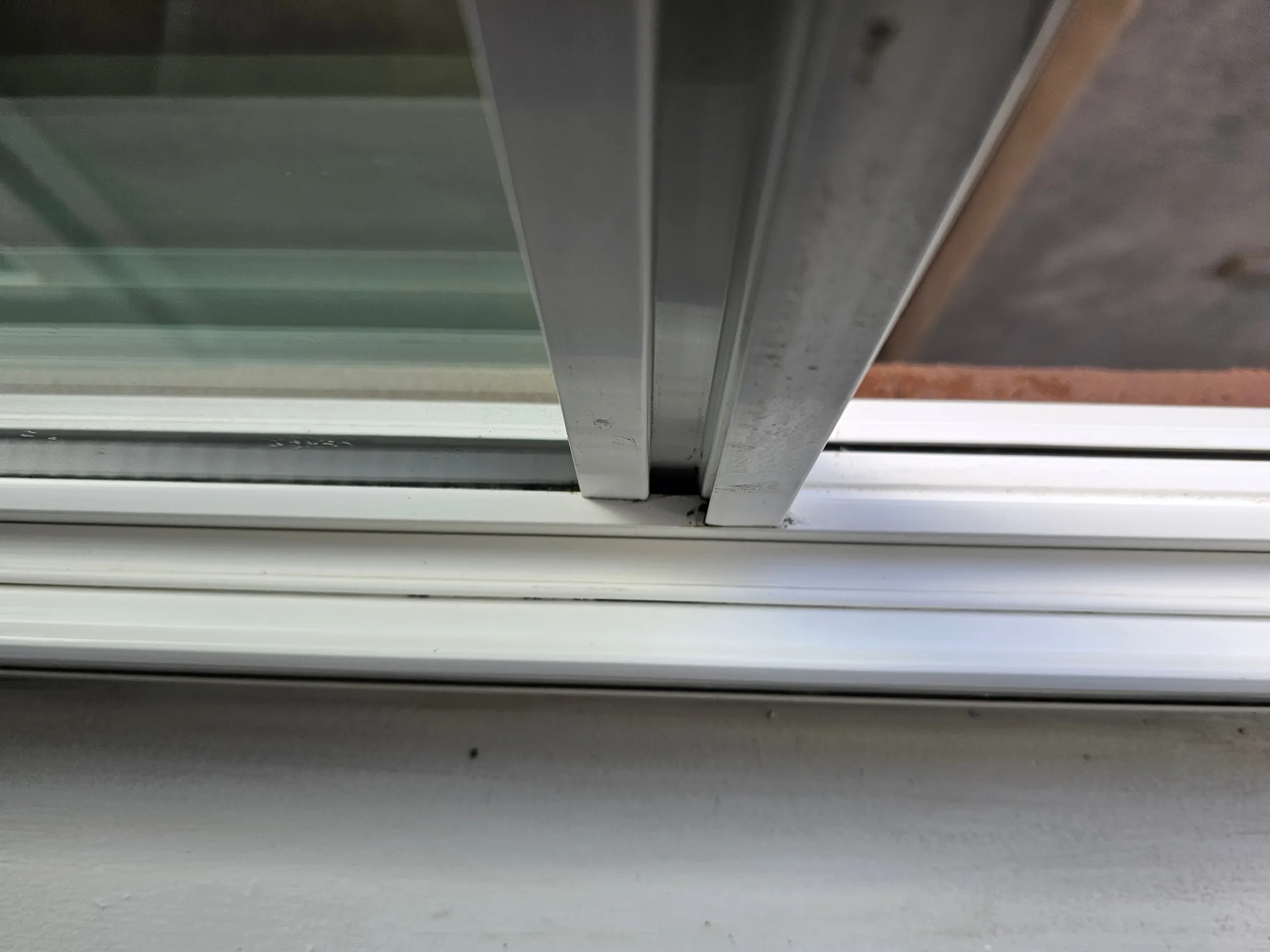 Close-up of a cleaned window track after professional deep cleaning