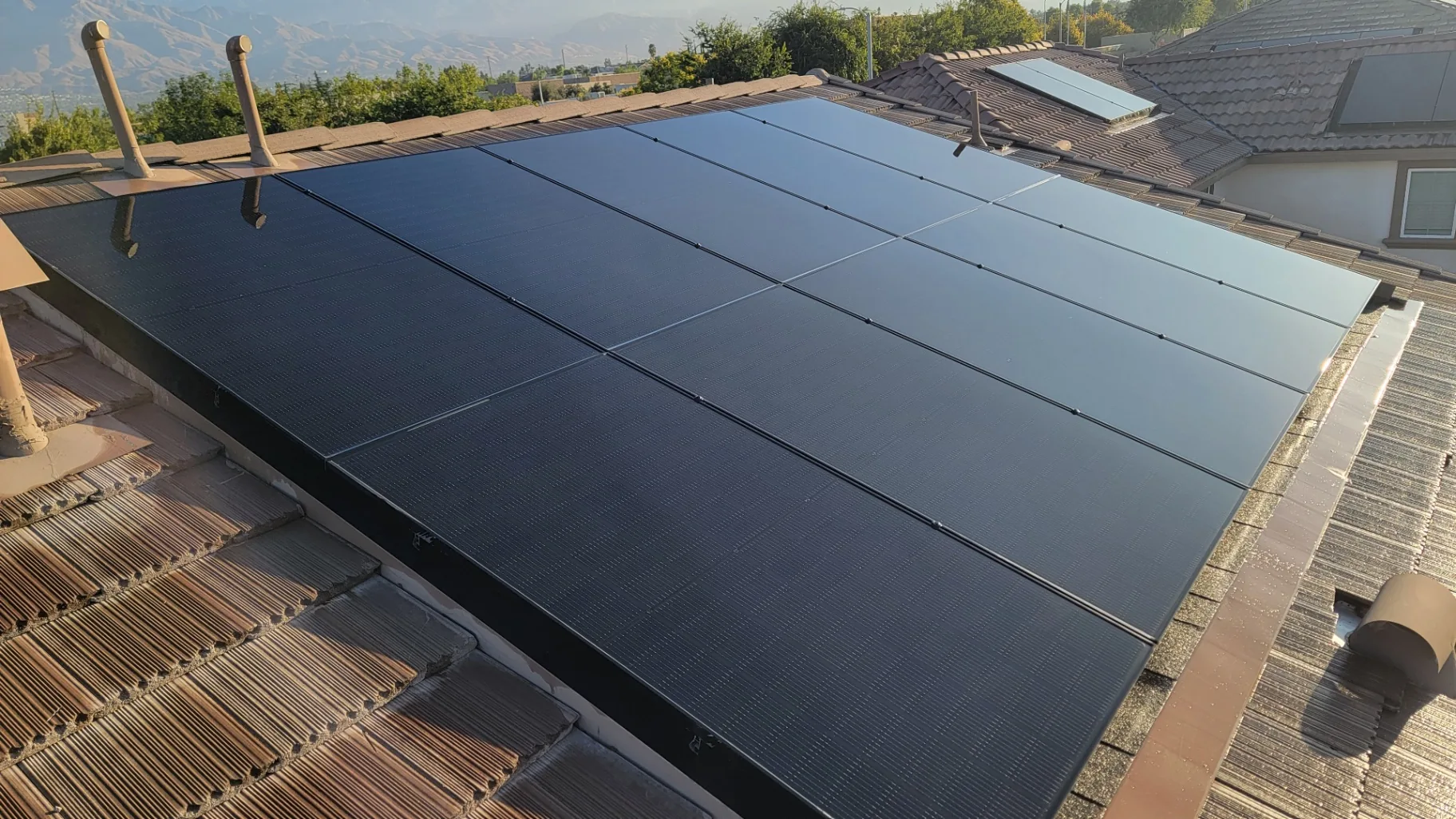Sleek all-black solar array spotless after Transparent Solutions cleaning