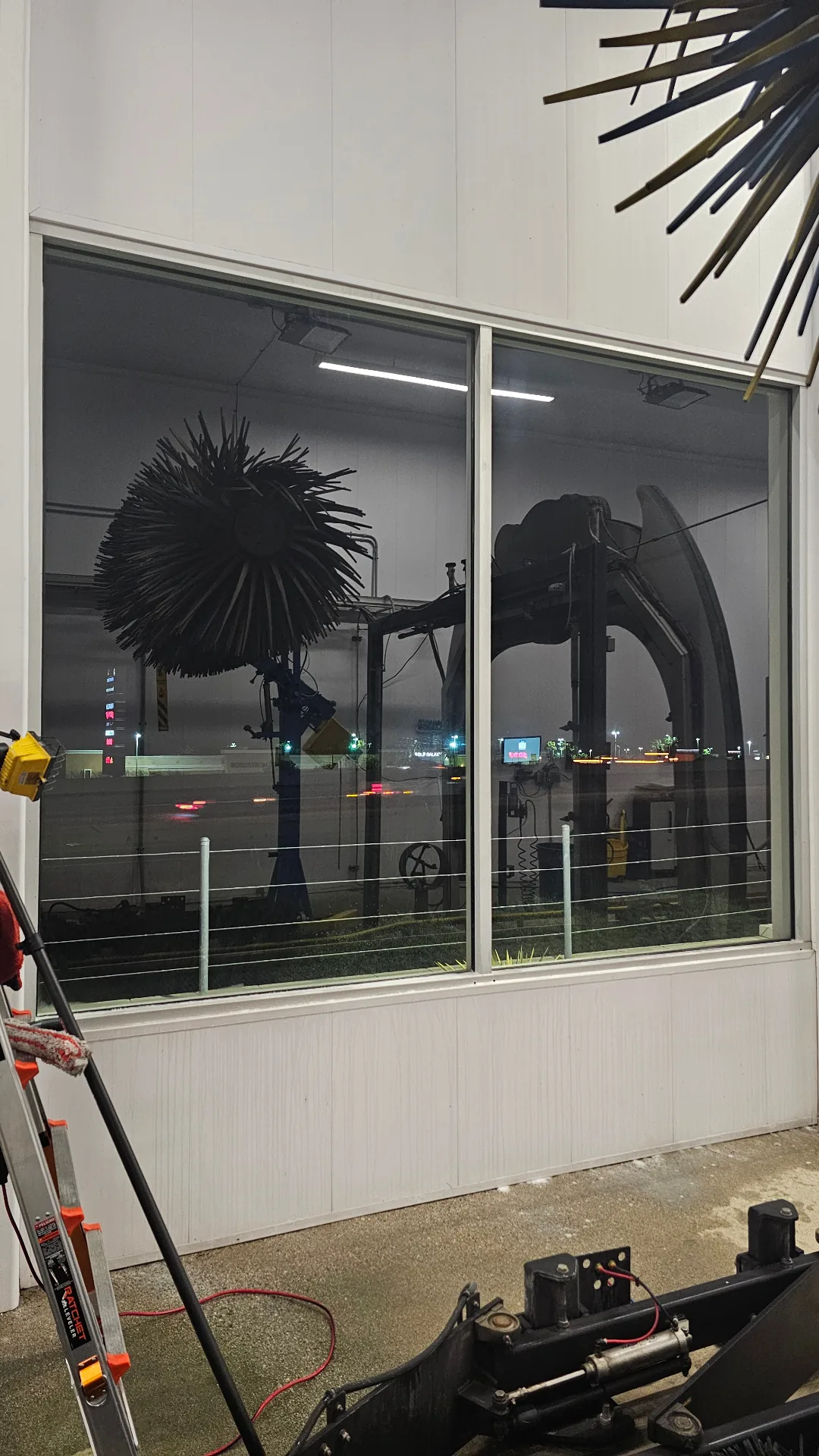 Same commercial storefront glass restored to clear visibility after Transparent Solutions hard water removal