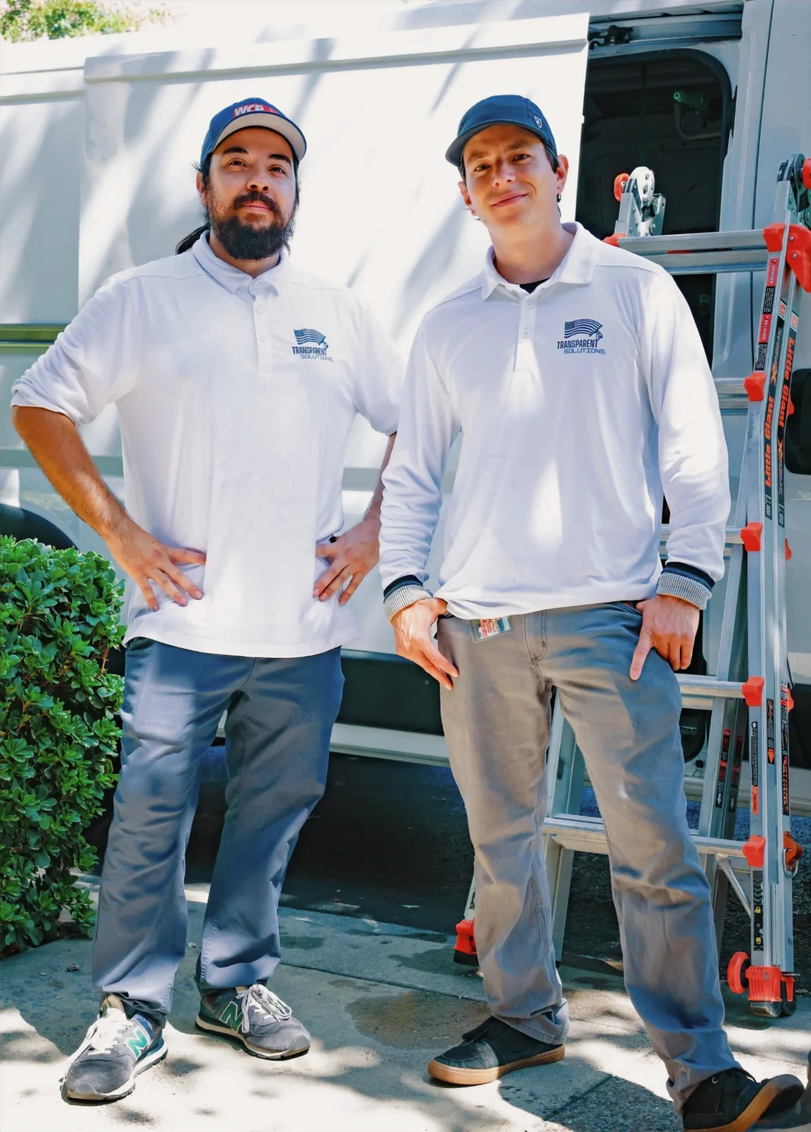 The Transparent Solutions owners in front of a company service van