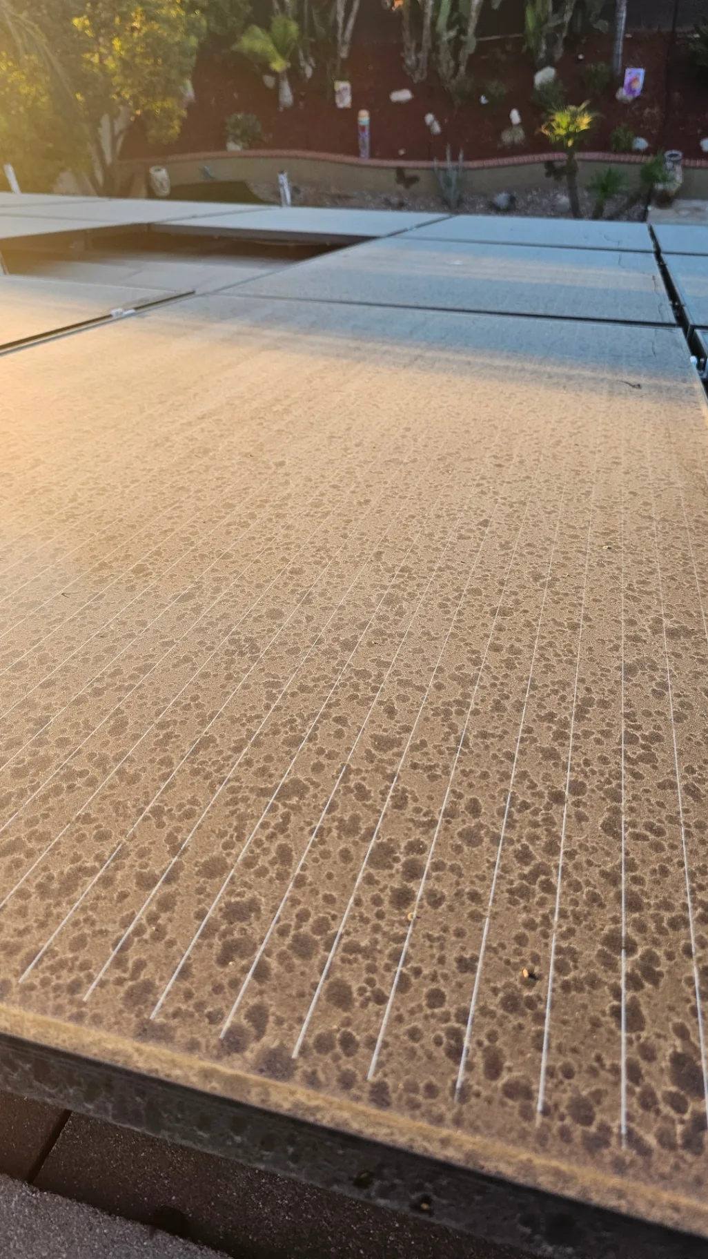 Close-up of dirty solar panel surface with heavy soil buildup before cleaning