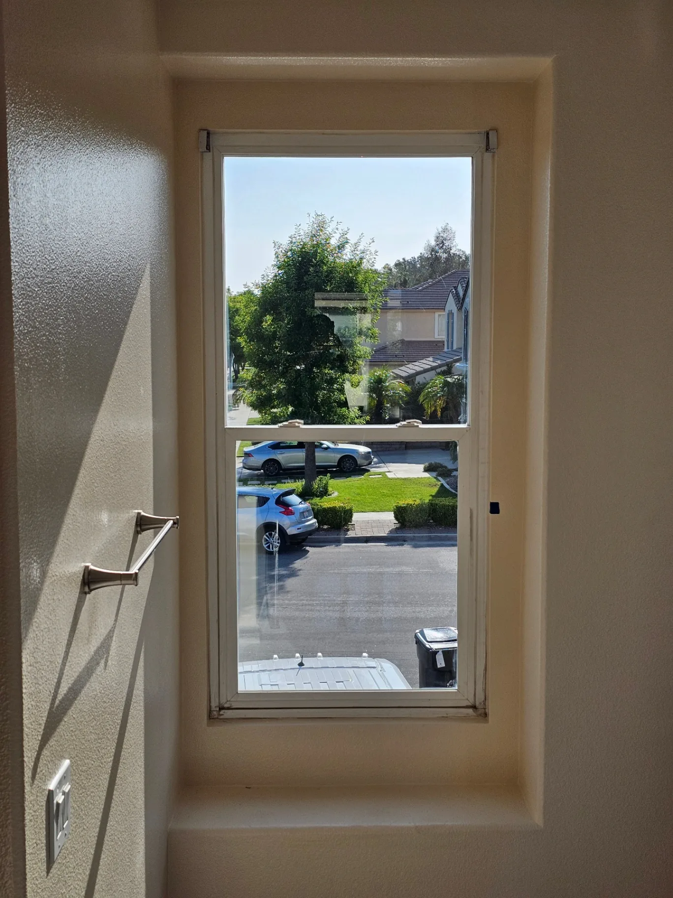 Clean residential window showing a sharp street-level view after Transparent Solutions service
