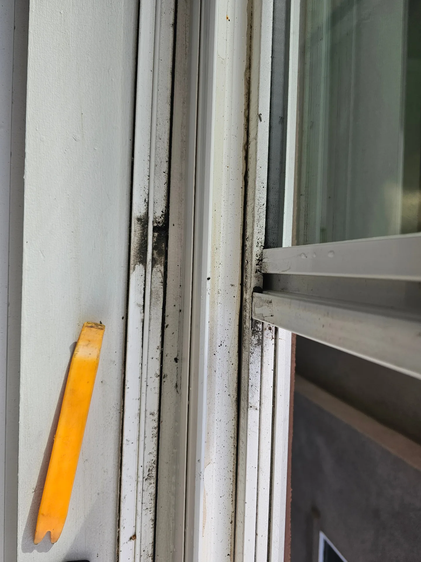 Dirty sliding window track before Transparent Solutions deep cleaning