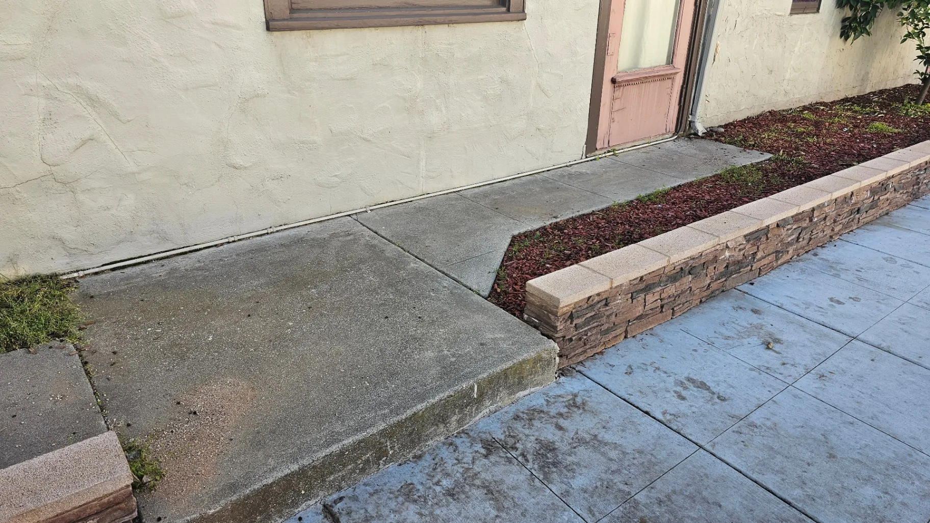 Dirty residential concrete walkway before Transparent Solutions pressure washing